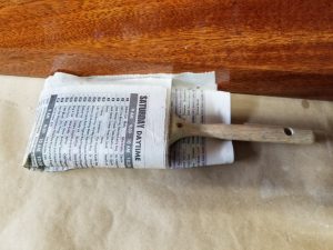 natural bristle brush stored in newspaper